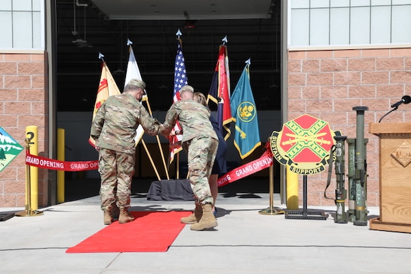 Army Maj. Gen. Matthew McFarlane, Commander, 4th Infantry Division, and several VIPs cut the ribbon to mark the opening of the new Ammunition Supply Point facilities on Fort Carson, CO, March 19