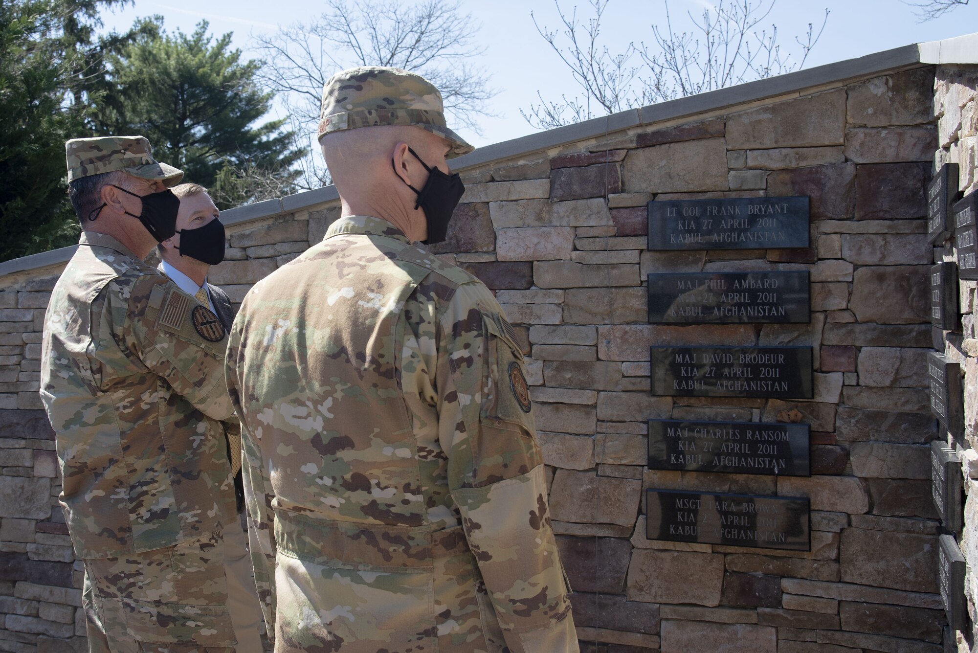 Photo of Airmen looking at the Air Advisor Memorial