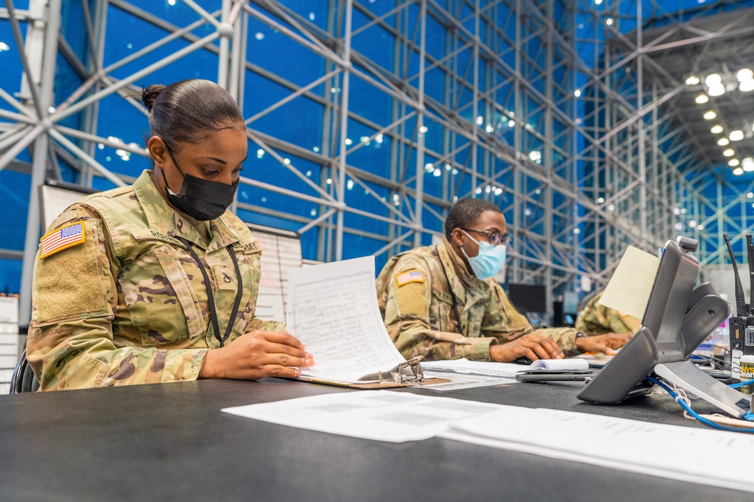 Soldiers prepare for next operational day in support of state efforts to provide mass COVID-19 vaccinations administered by New York State Department of Health, at Javits Convention Center in Manhattan, February 14, 2021 (U.S. Army National Guard/Sebastian Rothwyn)