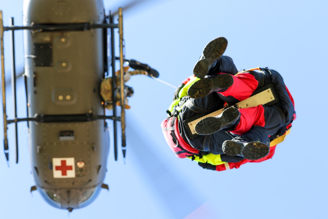 Firefighters with Mississippi Task Force Urban Search and
Rescue ride hoist to UH-72 Lakota while participating in Patriot
South 20, at Guardian Centers in Perry, Georgia, February 28,
2020 (U.S. Army National Guard/Christopher Shannon)