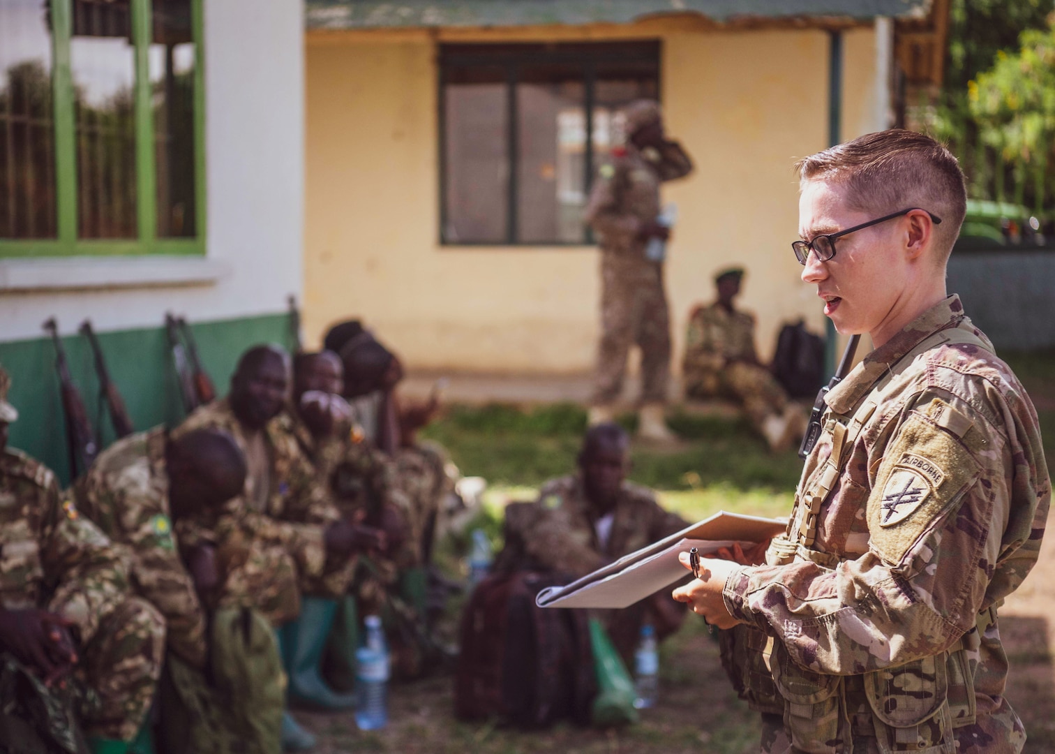 Army instructor with 403rd Civil Affairs Battalion, assigned to Combined Joint Task Force–Horn of Africa, writes team evaluation during Counter Illicit Trafficking Junior Leadership Course examination at Queen Elizabeth Park, Uganda, October 10, 2019 (U.S. Air Force/J.D. Strong II)