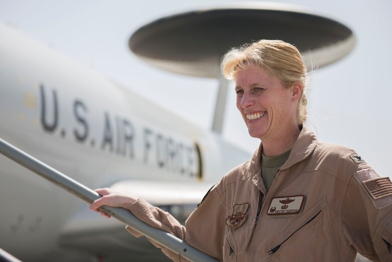 U.S. Air Force Col. Kristen Thompson, 380th Expeditionary Operations Group commander stands in front of an E-3 Sentry aircraft at Al Dhafra Air Base, United Arab Emirates, March 29, 2021. Thompson grew up in Anaheim Hill, California, before she attended the U.S. Air Force Academy as part of the class of 2001.  (U.S. Air Force photo by Staff Sgt. Zade Vadnais)