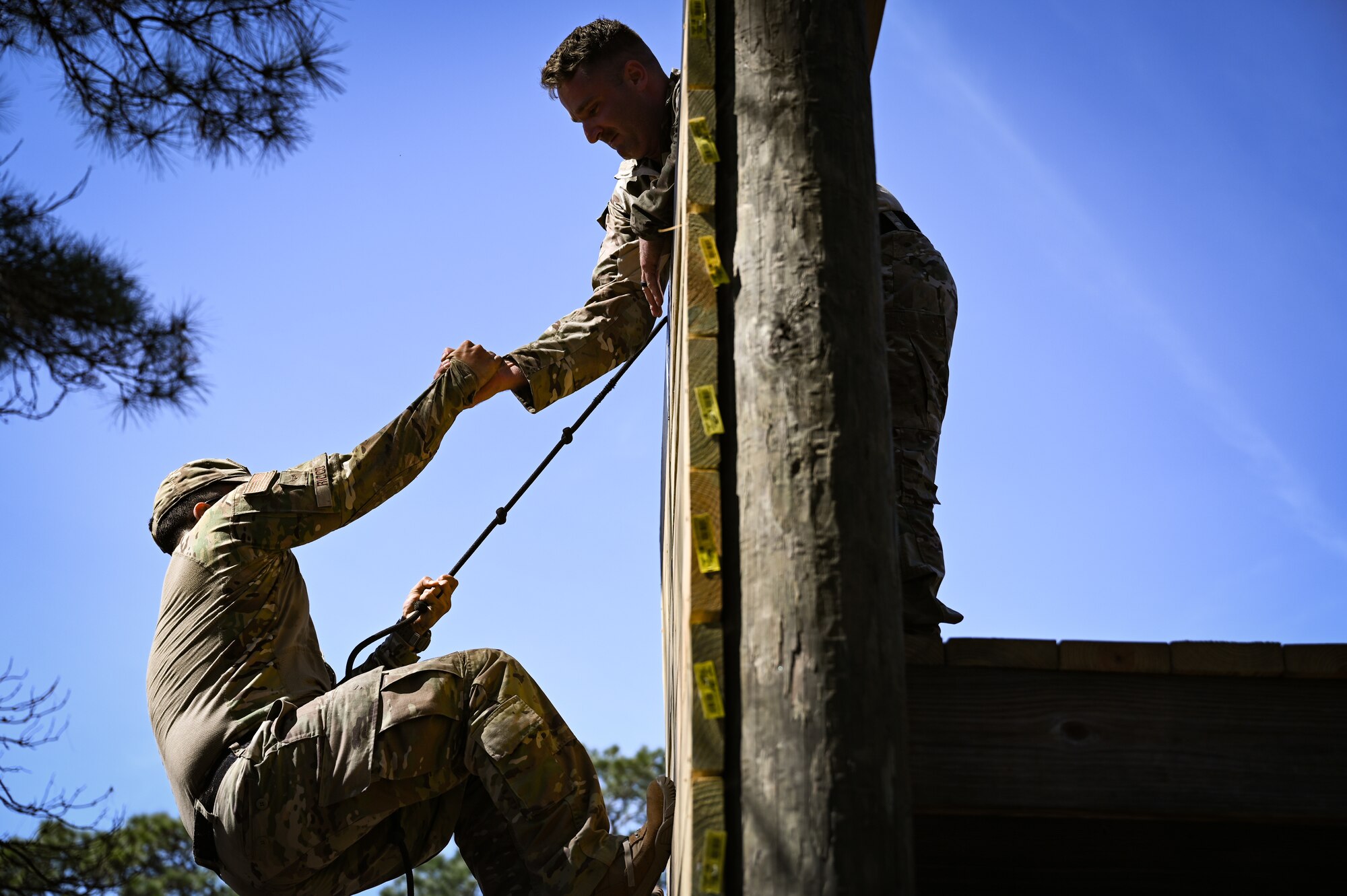 U.S. security forces Airmen with the 165th Security Forces Squadron, Georgia Air National Guard, complete an 11-task obstacle course Mar. 12, 2021 during a physical assessment try-out for the new 165th Strategic Response Team that the 165 SFS is starting. The assessment requires each defender to complete an official Air Force Physical Fitness Test, a timed obstacle course individually and again as a team, a ¼ mile ruck march while carrying a telephone pole as a team while wearing full combat gear and a gas mask, shooting box drills with a rifle and a pistol and lastly, an interview and feedback session. (U.S. Air National Guard photo by Tech. Sgt. Caila Arahood)