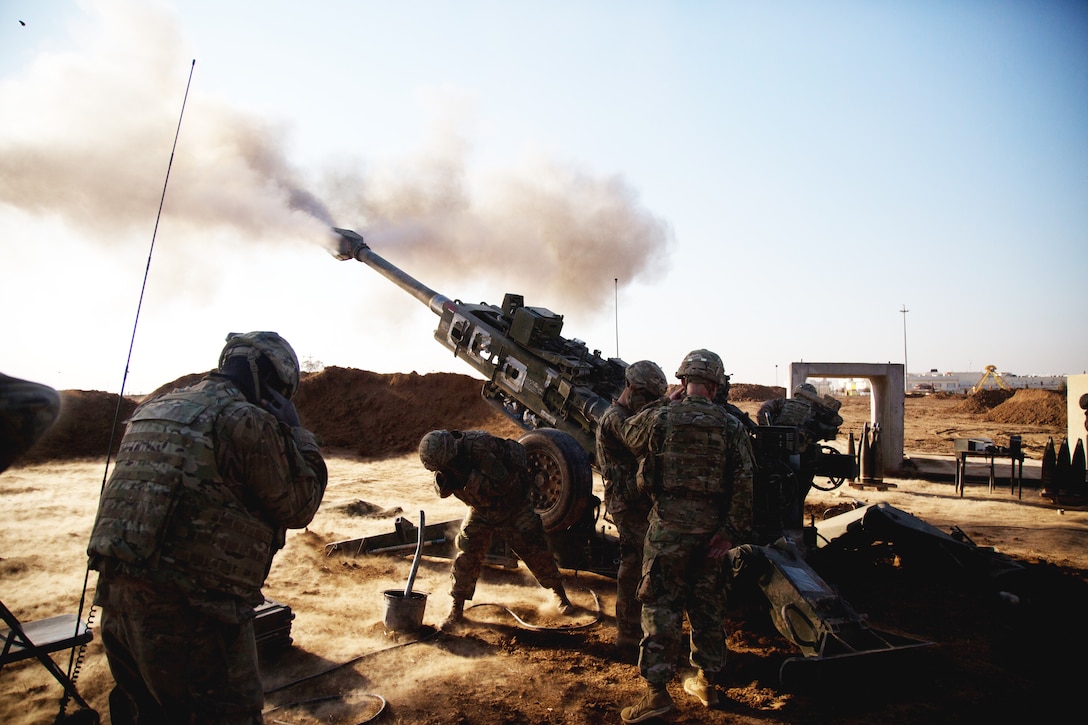 U.S. Soldiers assigned to Battery C, 2nd Battalion, 319th Airborne Field Artillery Regiment, 82nd Airborne Division, fire M777 155mm howitzer during fire mission near Mosul, Iraq, February 3, 2017, in support of Combined Joint Task Force–Operation Inherent Resolve (U.S. Army/Craig Jensen)