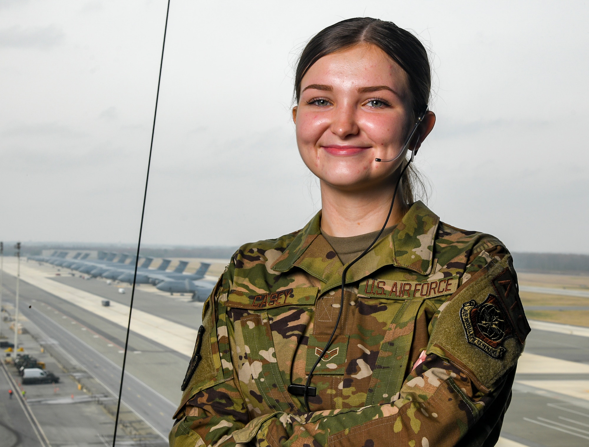 Airman 1st Class Alexis Casey, 436th Operations Support Squadron air traffic control journeyman, poses for a photo in the air traffic control tower at Dover Air Force Base, Delaware, March 25, 2021. Casey is the first female air traffic control tower Airman certified at Dover AFB in more than two years after completing a nearly year-long upgrade training program. (U.S. Air Force photo by Airman 1st Class Stephani Barge)