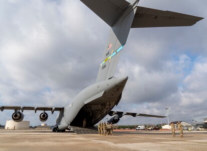 Airman practice a dignified transfer during the Force Support Contingency Training-Mortuary course at Dover Air Force Base, Delaware, Mar. 23, 2021. A dignified transfer is the solemn movement honoring the return of a service member from the theater of operations where they have died back to American soil. (U.S. Air Force photo by Jason Minto)
