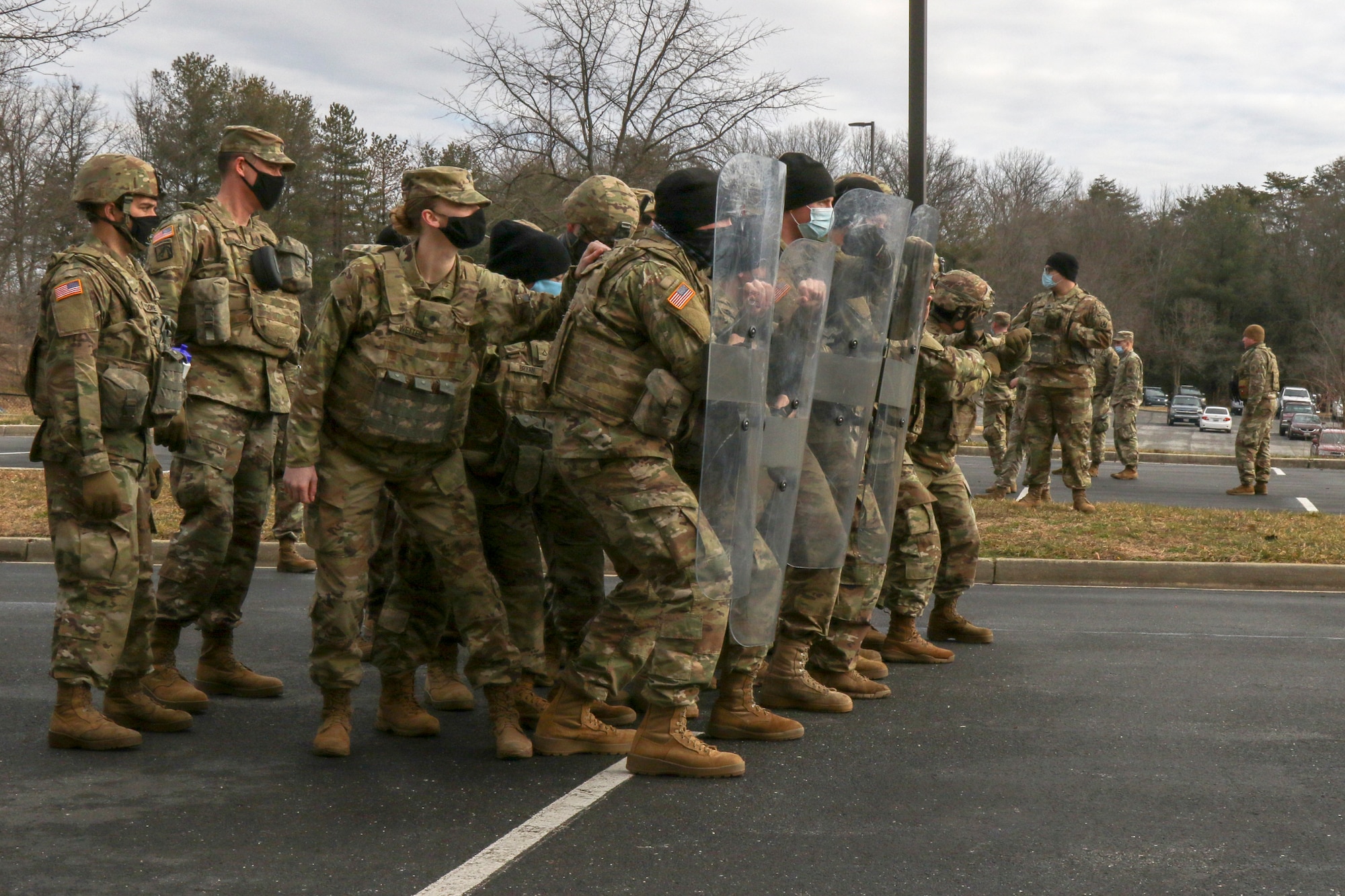 U.S. Soldiers with the 172nd Cavalry Regiment, 86th Infantry Brigade Combat Team (Mountain), Vermont National Guard, train replaceent Soldiers from the 186th BSB 86th Infantry Brigade Combat Team (Mountain) in crowd control in the parking lot of their hotel in Laurel, Maryland