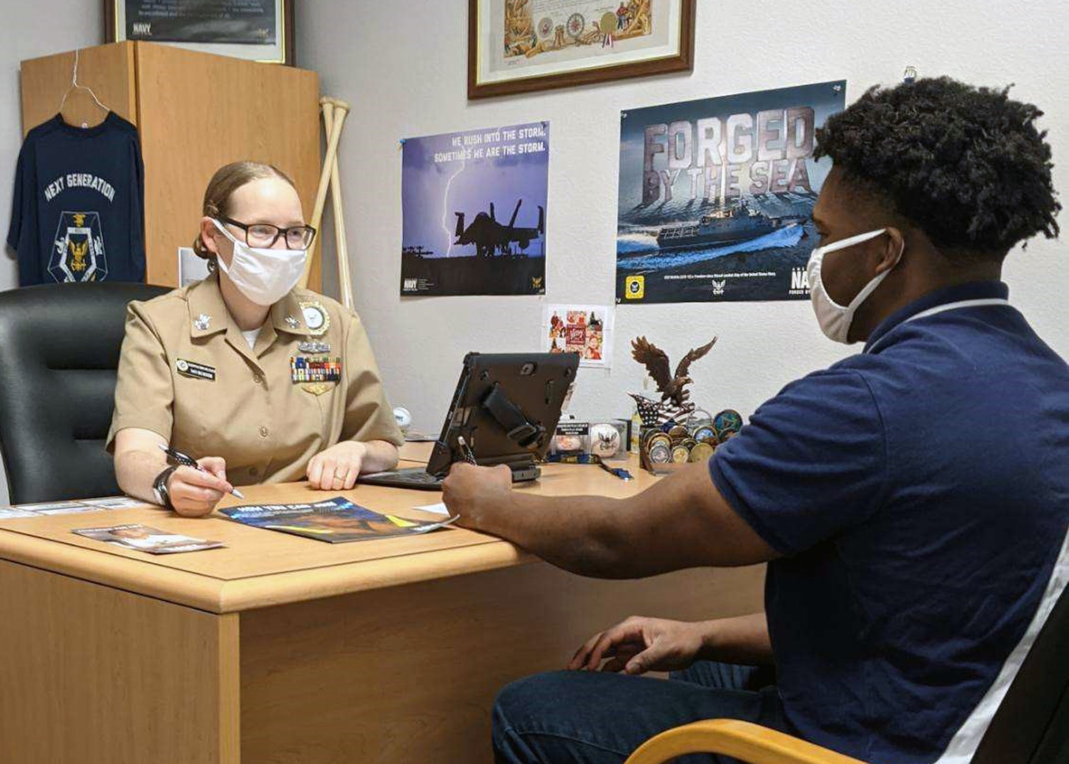 Petty Officer 1st Class Patricia Floch, an assessor assigned to Navy Recruiting Station South Corpus Christi, Talent Acquisition Onboarding Center Alamo City, conducts a 72-hour indoctrination of future Sailor Alvin Lawson Jr. at the recruiting station.