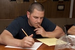 ATLANTIC OCEAN - Petty Officer 1st Class Eric Crouse, stationed aboard the U.S. Coast Guard Cutter Eagle participates in the May 2010 Service Wide Examination (SWE) during the Eagle's transit to Puerto Rico Tuesday, May 4, 2010. The SWE is a competition, which certain enlisted rates must take in order to advance based on their raw score, sea time, time in service, time in rank, and award points. U.S. Coast Guard photo by Petty Officer 2nd Class Jetta H. Disco.