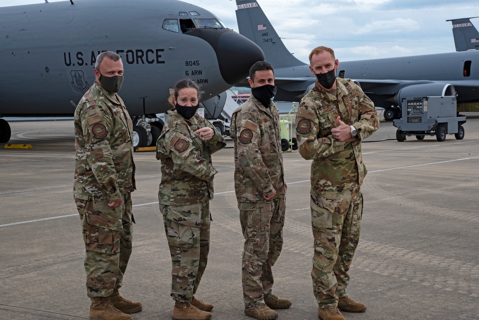 U.S. Air Force Chief Master Sgt. Wade Claussen, 99th Air Refueling Squadron superintendent, Chief Master Sgt. Shae Gee, 6th Air Refueling Wing command chief, Lt. Col. Doug Curran, 99th ARS commander and Col. Ben Jonsson, 6th ARW commander pause for a photo on the flight line at Sumpter Smith Joint National Guard Base, in Birmingham, Ala., March 30, 2021.