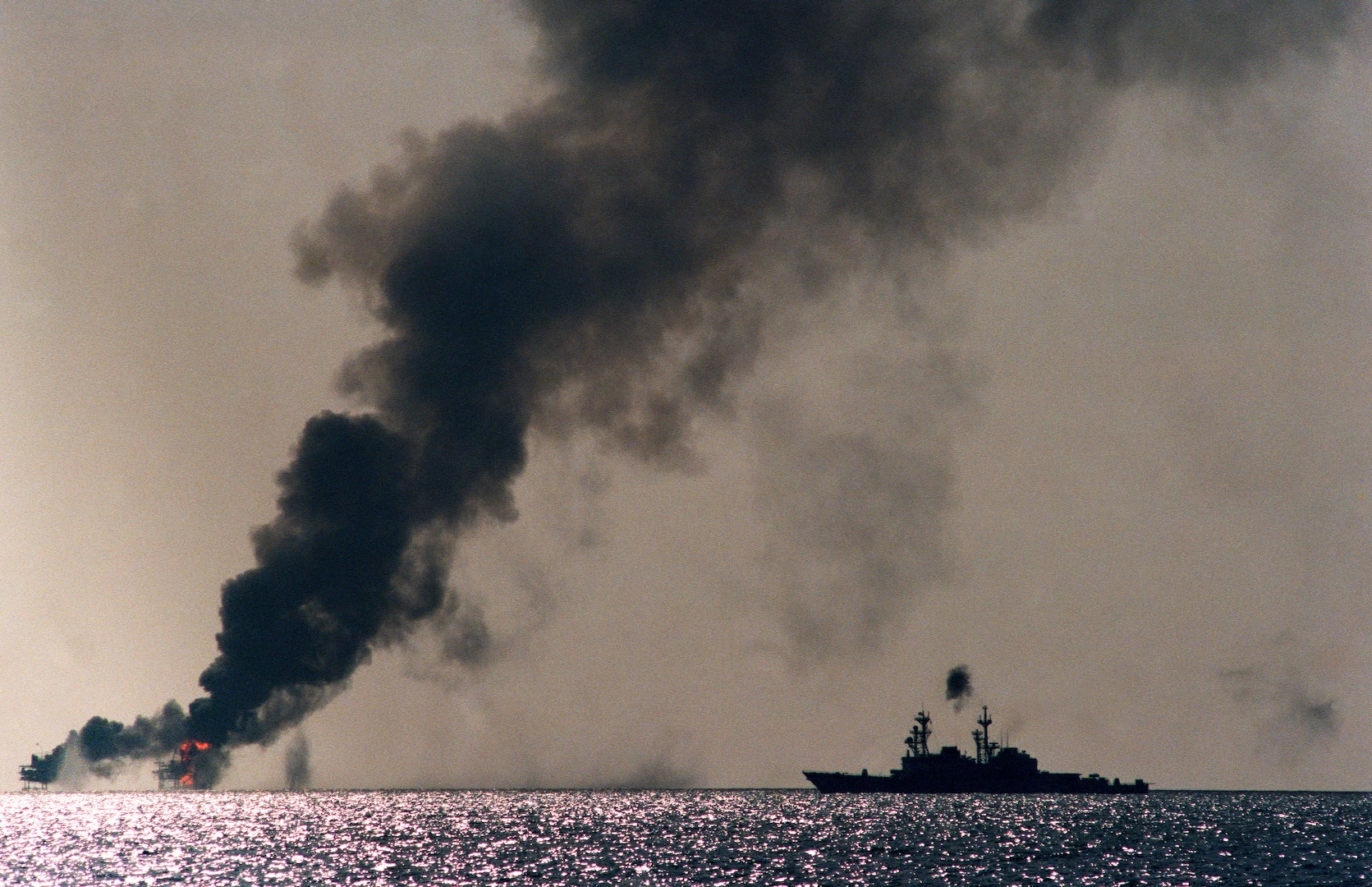 USS John Young shells two Iranian command and control platforms in response to recent Iranian missile attack on reflagged Kuwaiti super tanker, October 19, 1987 (U.S. Navy/National Archives and Records Administration)