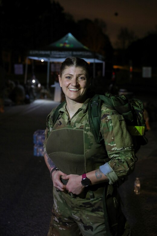 Sgt. 1st Class Kristen Bell, Civil Affairs Team Sergeant, 404th Civil Affairs Battalion (Airborne), smiles with pride at the end of the Fort Bragg Norwegian Foot March qualification march on March 26th, 2021. Bell completed the 18.6 mile course 22 minutes under the time allotted for her age, while carrying a military-style ruck weighing in at 31 pounds. Her accomplishment earned her the coveted foreign badge for wear on her Army Service Uniform.