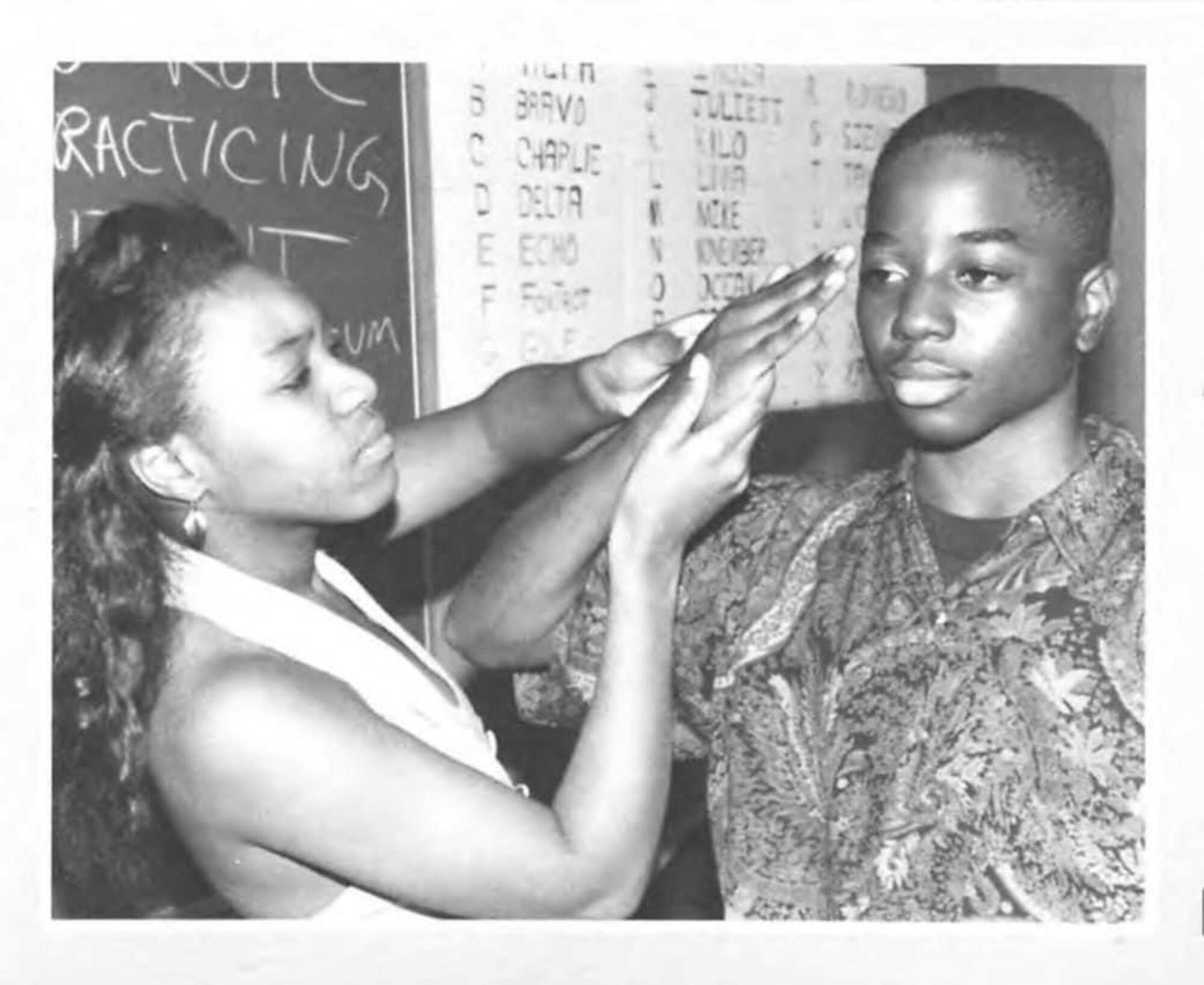 Chief Master Sgt. Raisean Lasenberry, Air Force Global Strike Command 608 Air Operations Center chief enlisted manager practices his salute during his high school JROTC course. (Courtesy photo)
