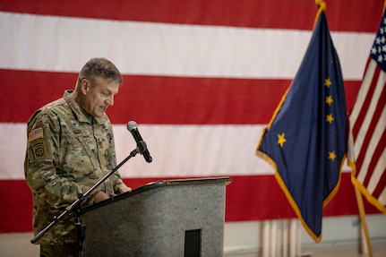 Col. Richard Koch, Alaska Army National Guard chaplain, leads a prayer at the 38th Troop Command change of responsibility ceremony on Joint Base Elmendorf-Richardson, Alaska, March 30. Command Sgt. Maj. John Phlegar assumed the role as the senior enlisted leader from Command Sgt. Maj. Maureen Meehan, making Phlegar the senior noncommissioned officer in charge of the brigade. (U.S. Army National Guard photo by Edward Eagerton)