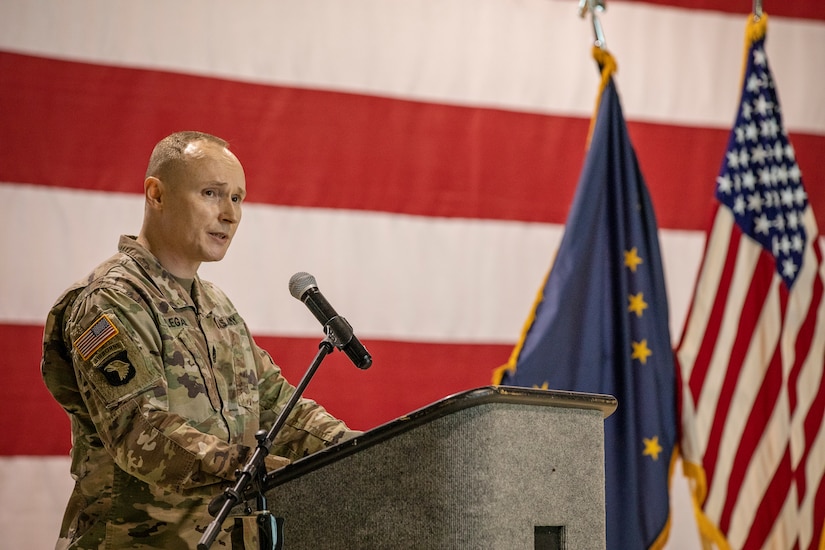 Command Sgt. Maj. John Phlegar, the incoming senior noncommissioned officer in charge, 38th Troop Command, Alaska Army National Guard, gives a speech during a change of responsibility ceremony on Joint Base Elmendorf-Richardson, Alaska, March 30. Phlegar assumed the role as the senior enlisted leader from Command Sgt. Maj. Maureen Meehan, making Phlegar the senior noncommissioned officer in charge of the brigade. (U.S. Army National Guard photo by Edward Eagerton)