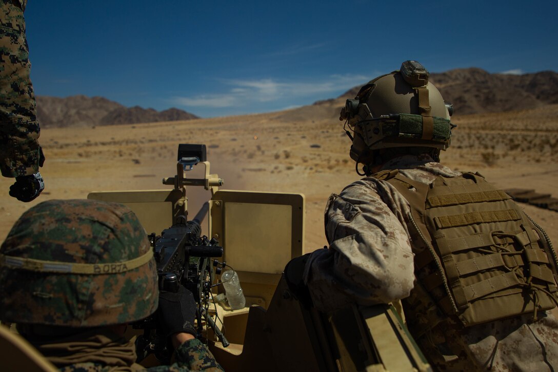 U.S. Marines with 7th Marine Regiment, 1st Marine Division, conduct live fire training on Marine Corps Air Ground Combat Center, Twentynine Palms, California, March 18, 2021. The training was conducted to increase familiarity with operating the weapon systems while mounted on a tactical vehicle. (U.S. Marine Corps photo by Cpl. Chandler Mejean)