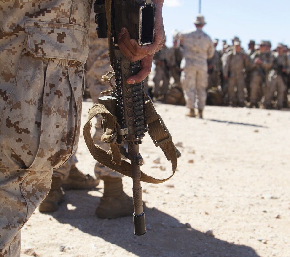 U.S. Marines with 1st Battalion, 5th Marine Regiment, 1st Marine Division, are briefed after arriving aboard Marine Corps Air Ground Combat Center, Twentynine Palms, California, on March 26, 2021. Marines with 1/5 were transported from Camp Pendleton, California, to MCAGCC in order to take part in Marine Air Ground Task Force, Service Level Training Exercise 3-21. (U.S Marine Corps photo by Lance Cpl. Jaquliyn Davis)