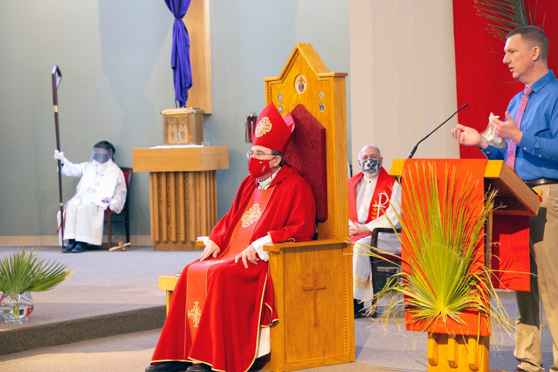 Bishop Neal Buckon, Vicar of the Western Half of the United States for the Archdiocese of the Military Services (AMS) conducts Holy Mass before Marines and Sailors of the Catholic parish at a Palm Sunday service given at the Immaculate Heart of Mary Catholic Chapel, Marine Corps Air Ground Combat Center, Twentynine Palms.