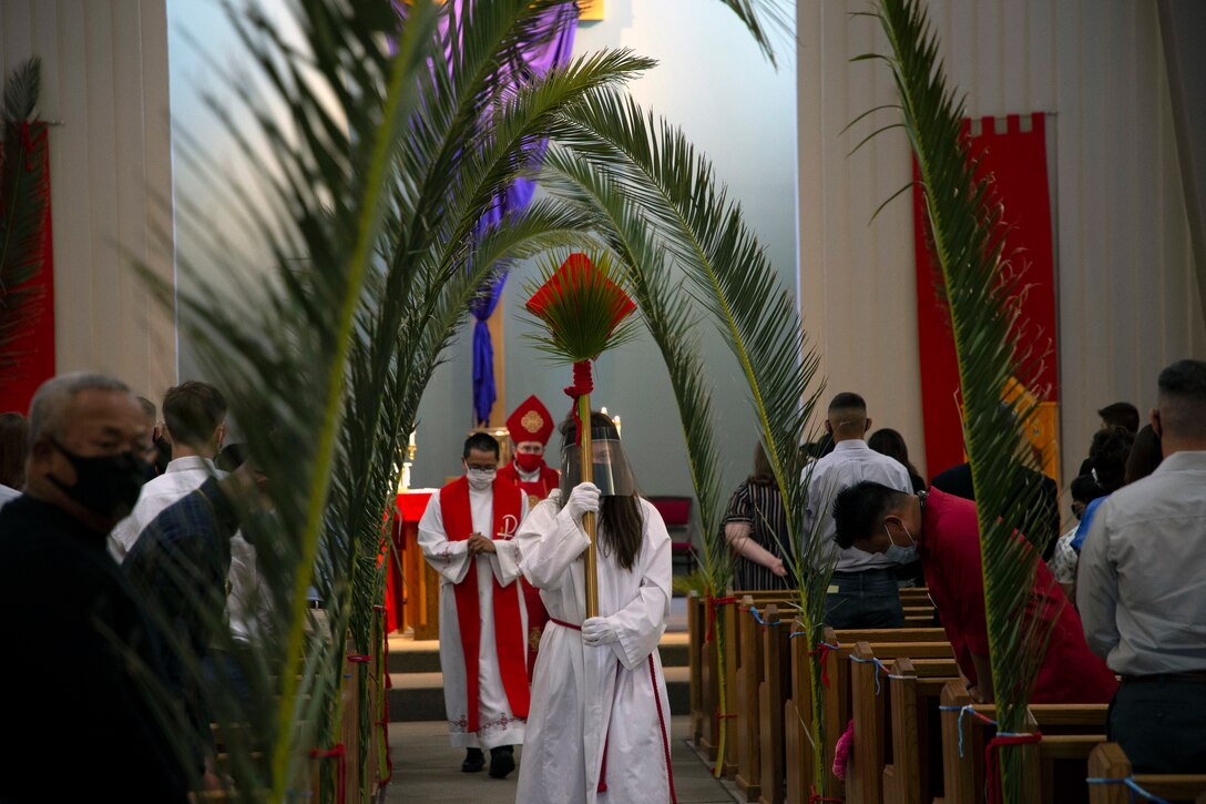 Bishop Neal Buckon, Vicar of the Western Half of the United States for the Archdiocese of the Military Services (AMS) conducts Holy Mass before Marines and Sailors of the Catholic parish at a Palm Sunday service given at the Immaculate Heart of Mary Catholic Chapel, Marine Corps Air Ground Combat Center, Twentynine Palms.