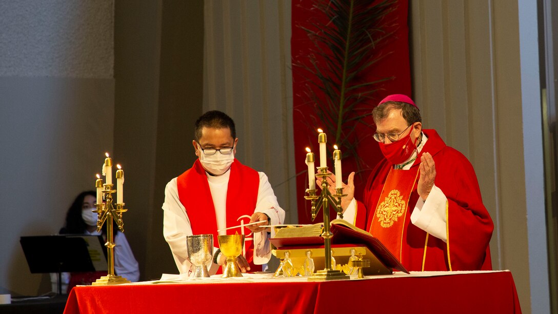 Bishop Neal Buckon, Vicar of the Western Half of the United States for the Archdiocese of the Military Services (AMS) conducts Holy Mass before Marines and Sailors of the Catholic parish at a Palm Sunday service given at the Immaculate Heart of Mary Catholic Chapel, Marine Corps Air Ground Combat Center, Twentynine Palms.