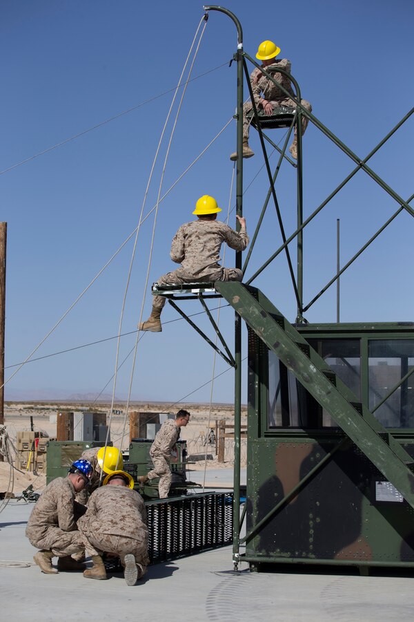 U.S. Marines with Charlie Detachment, Marine Air Combat Control Squadron 2, Marine Air Control Group 28, 2nd Marine Aircraft Wing set up an expeditionary air traffic control tower in preparation for Service Level Training Exercise 3-21 at Marine Corps Air Ground Combat Center, Twentynine Palms, California, March 30, 2021. This ATC tower plays a crucial role in Marines ability to direct aircraft during large scale training aboard MCAGCC. (U.S. Marine Corps photo by Lance Cpl. Jacquilyn Davis)