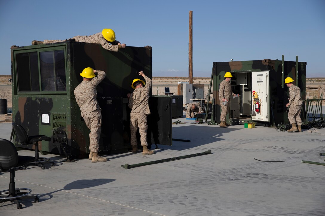 U.S. Marines with Charlie Detachment, Marine Air Combat Control Squadron 2, Marine Air Control Group 28, 2nd Marine Aircraft Wing set up an expeditionary air traffic control tower in preparation for Service Level Training Exercise 3-21 at Marine Corps Air Ground Combat Center, Twentynine Palms, California, March 30, 2021. This ATC tower plays a crucial role in Marines ability to direct aircraft during large scale training aboard MCAGCC. (U.S. Marine Corps photo by Lance Cpl. Jacquilyn Davis)