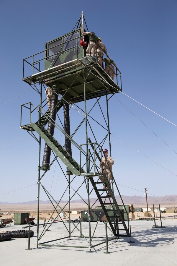 U.S. Marines with Charlie Detachment, Marine Air Combat Control Squadron 2, Marine Air Control Group 28, 2nd Marine Aircraft Wing set up an expeditionary air traffic control tower in preparation for Service Level Training Exercise 3-21 at Marine Corps Air Ground Combat Center, Twentynine Palms, California, March 30, 2021. This ATC tower plays a crucial role in Marines ability to direct aircraft during large scale training aboard MCAGCC. (U.S. Marine Corps photo by Lance Cpl. Jacquilyn Davis)