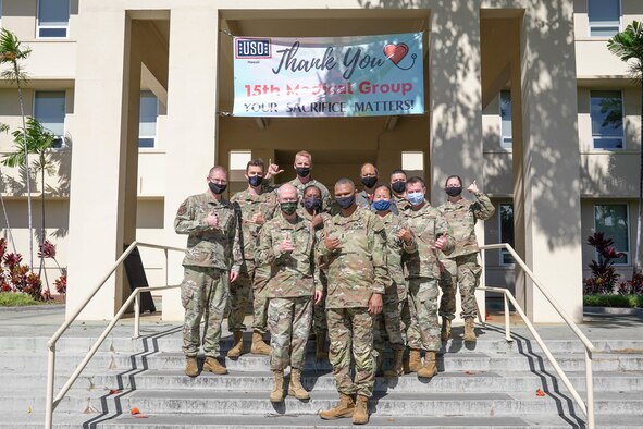 Lt. Gen. Ronald Place, Defence Health Agency director, and Command Sgt. Maj. Michael L. Gragg, Defence Health Agency senior enlisted leader, visit with 15th Wing Medical Group leadership during a visit at Joint Base Pearl Harbor-Hickam, Hawaii Feb. 26, 2021. The DHA caters to more than 400 military clinics and hospitals around the world while supporting and maintaining medical training, health and readiness. (U.S. Air Force photo by Airman 1st Class Makensie Cooper)