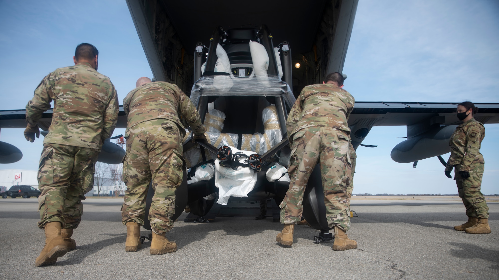 A photo of Airmen loading cargo