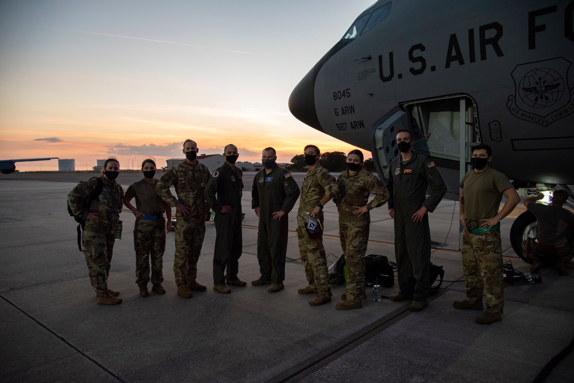 U.S. Air Force Col. Ben Jonsson, 6th Air Refueling Wing commander and Chief Master Sgt. Shae Gee, 6th Air Refueling Wing command chief pause for a photo with 6th Operations Group aircrew and 6th Maintenance Group crew chiefs March 30, 2021, at MacDill Air Force Base, Fla.