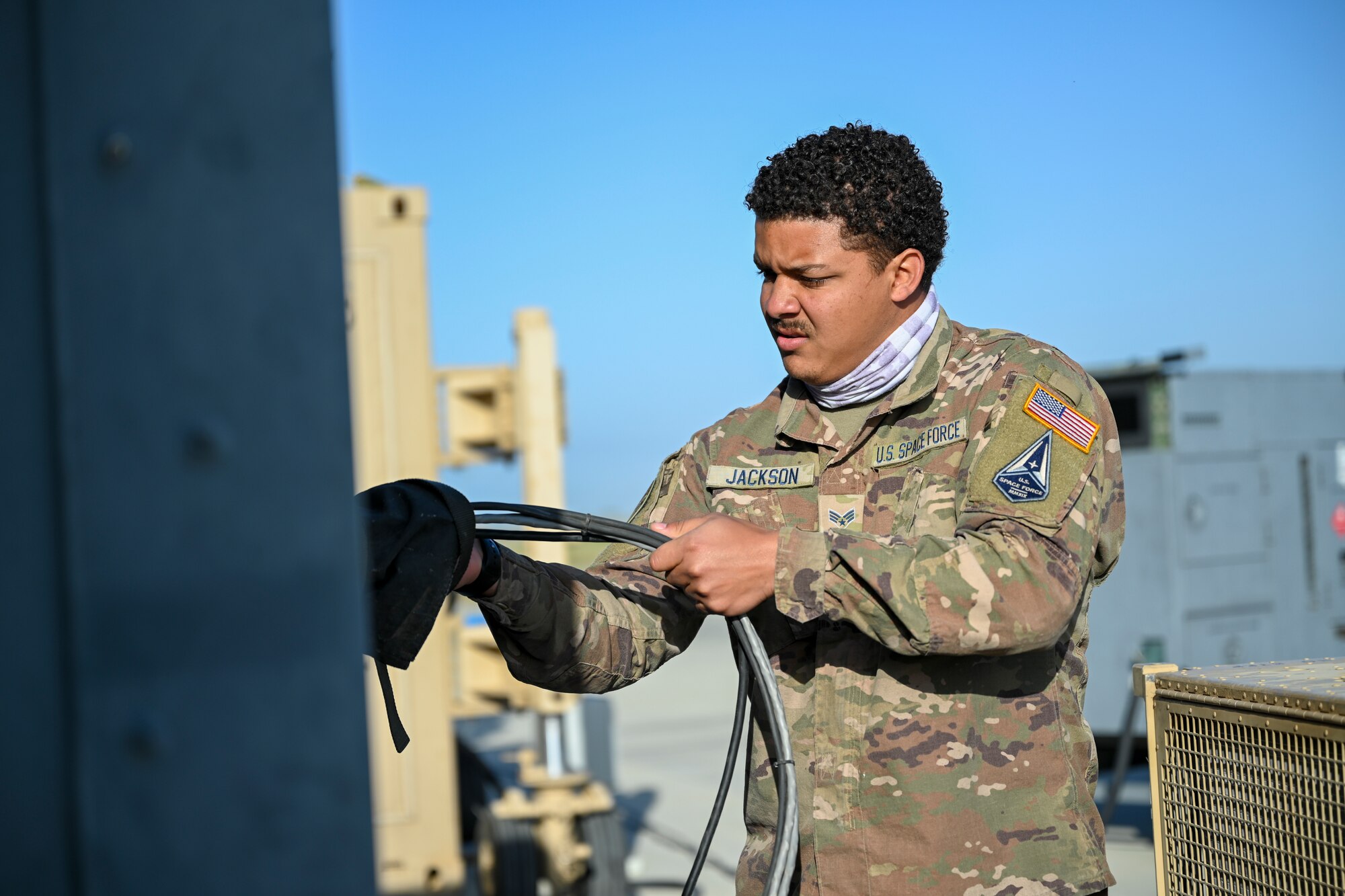 Specialist 3 Bronze Jackson, 49th Aircraft Maintenance Squadron aircraft communications maintenance unit technician, sets up MQ-9 Reaper cockpit power and network capabilities during Exercise Agile Reaper, April 16, 2021, on Point Mugu Air Naval Station, California. 
The 49th Wing currently has a small number of U.S. Space Force Guardians who assist with routine missions at Holloman Air Force Base, including MQ-9 maintenance. (U.S. Air Force photo by Senior Airman Kristin Weathersby)