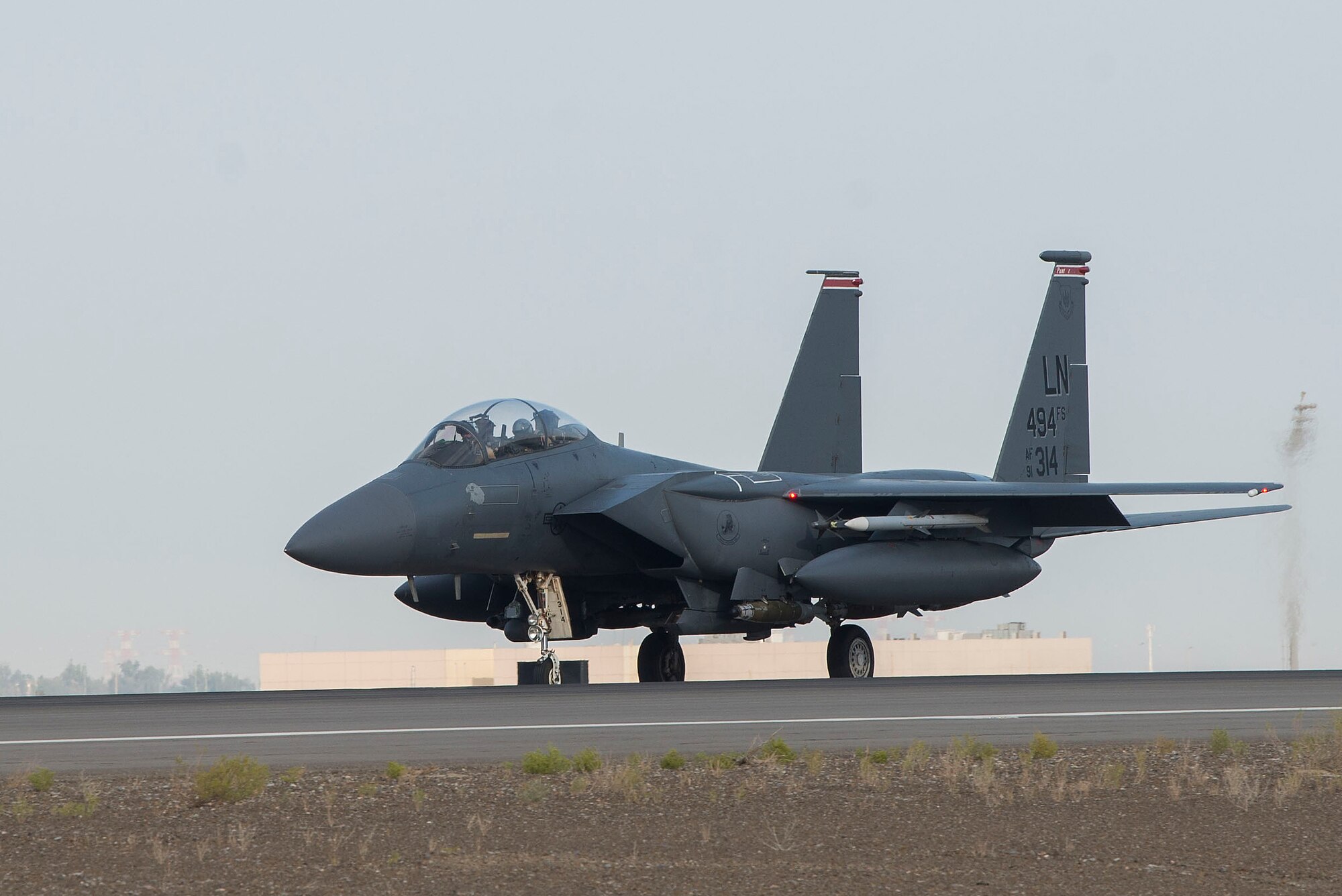 A U.S. Air Force F-15E Strike Eagle piloted by a member of the 494th Expeditionary Fighter Squadron (EFS) taxis on the flightline prior to takeoff at Al Dhafra Air Base (ADAB), United Arab Emirates, April 30, 2021.