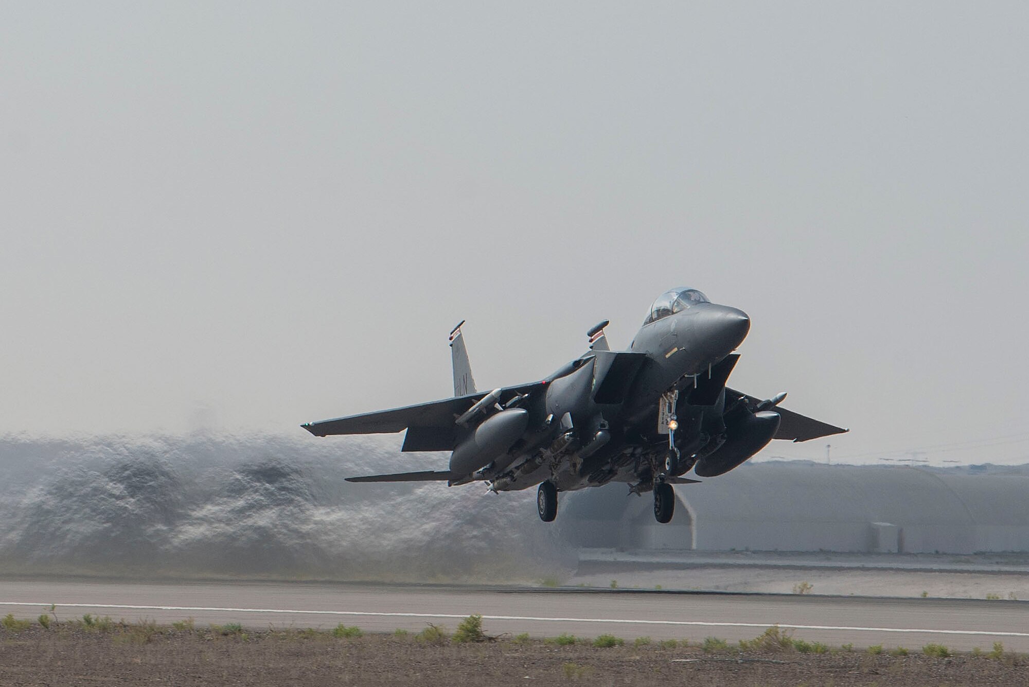 A U.S. Air Force F-15E Strike Eagle piloted by a member of the 494th Expeditionary Fighter Squadron takes off from Al Dhafra Air Base, United Arab Emirates, in support of regional security operations, April 30, 2021.