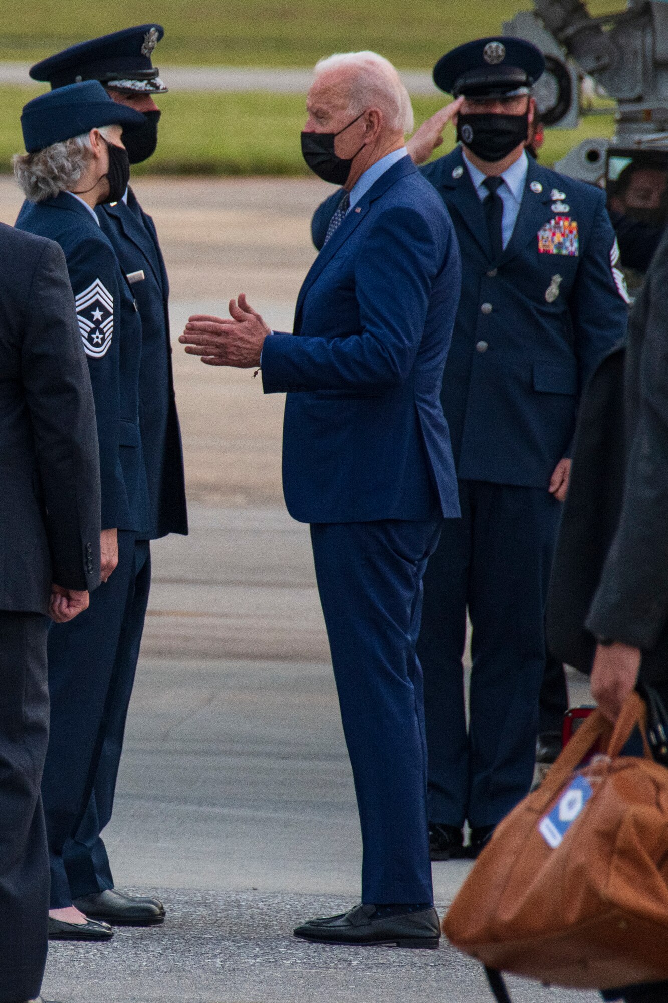 President Joe Biden speaks with Maj. Gen. John Healy, 22nd Air Force commander, and Chief Master Sgt. Vicki Robertson, 94th Airlift Wing command chief, shortly before boarding Air Force One at Dobbins Air Reserve Base, Ga on April 29, 2021. The president and first lady arrived to the base via Marine One where they were greeted by base leadership before heading back to Washington, D.C. on Air Force One. (U.S. Air Force photo by Andrew Park)