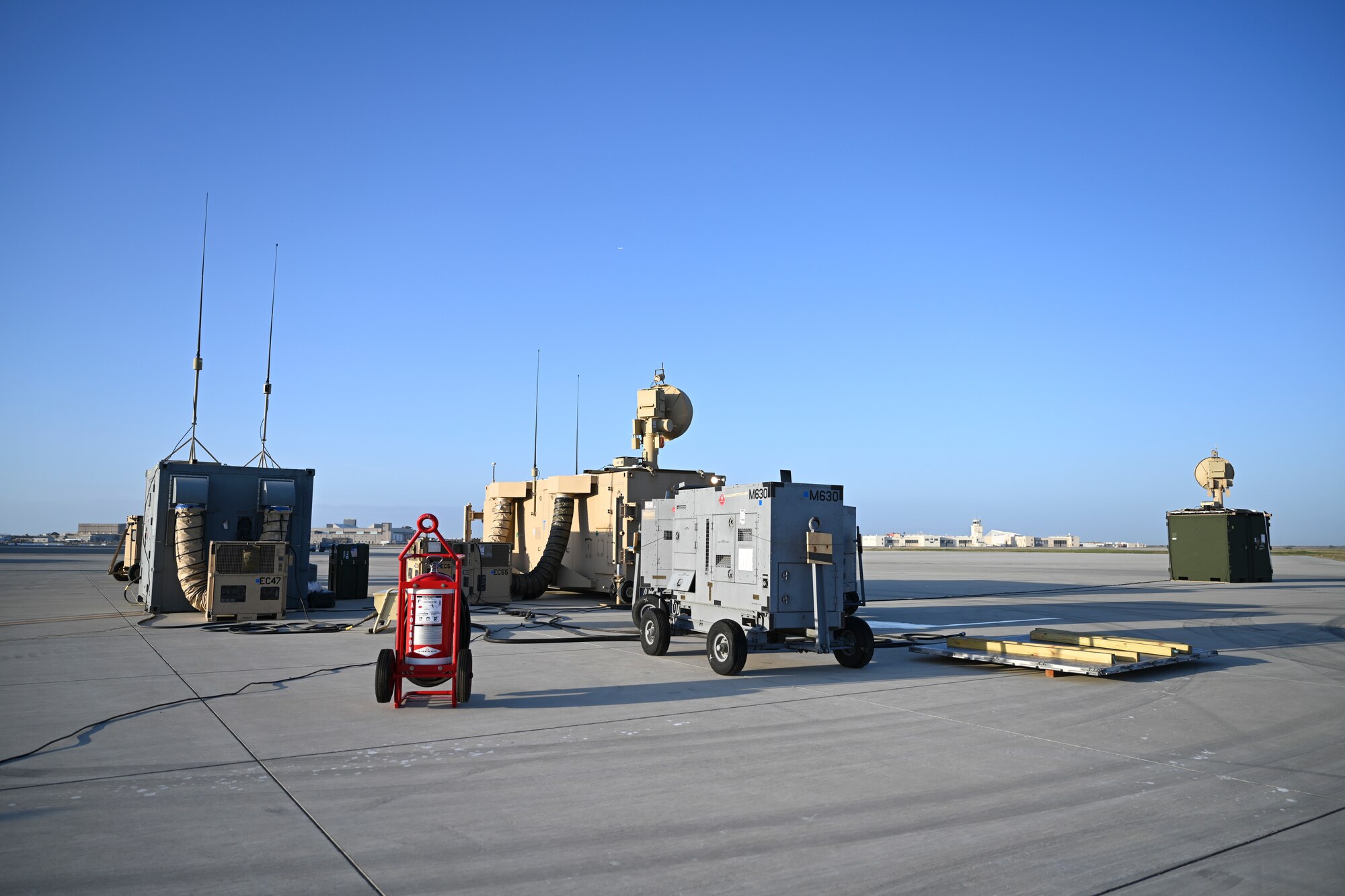 Equipment to operate the MQ-9 Reaper sits on the flightline, April 16, 2021, on Naval Air Station Point Mugu, California. Airmen are able to set up a site to operate MQ-9s within hours of arrival to a location. (U.S. Air Force photo by Senior Airman Kristin Weathersby)