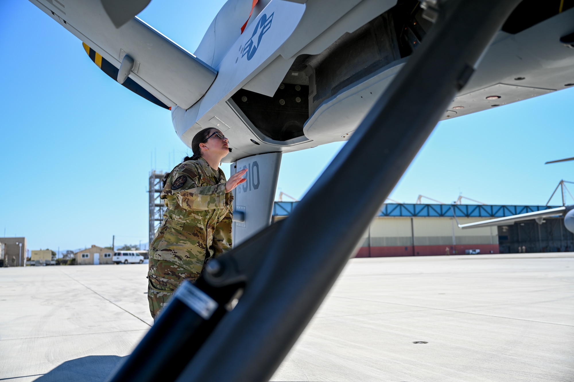 Capt. Chelsie Miller, 49th Operations Group MQ-9 Reaper pilot, conducts a preflight inspection April 19, 2021, on Point Mugu Naval Air Station, California. Preflight inspections are completed to ensure proper functionality of the aircraft before flight operations. (U.S. Air Force photo by Senior Airman Kristin Weathersby)