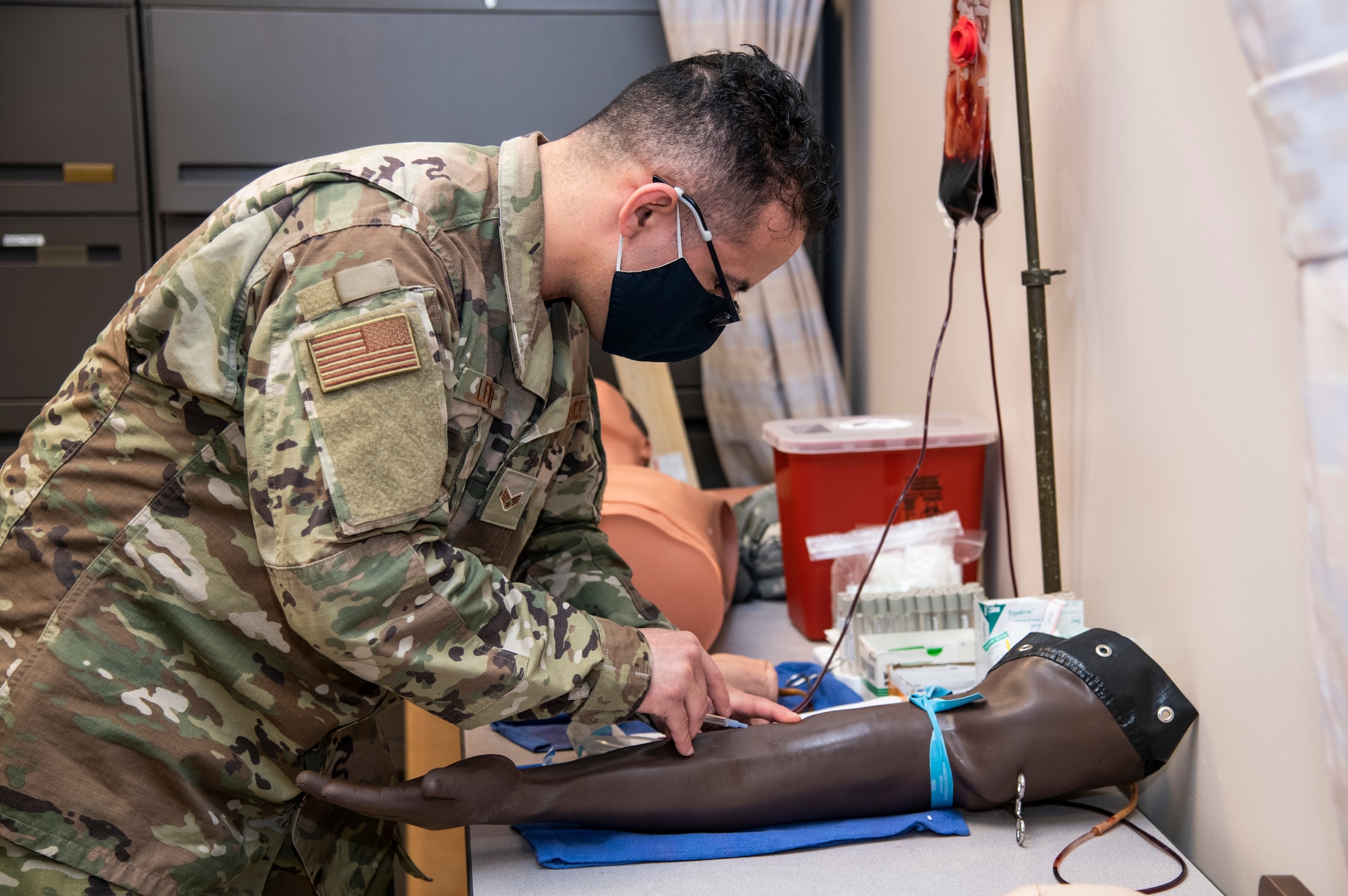 U.S. Air Force Senior Airman Issac Loreno, 932nd Airlift Wing, medical group, medical technician, practices drawing blood, Scott Air Force Base, Illinois, April 30, 2021. Loreno was nominated to do the airman spotlight for the May unit training assembly. (U.S. Air Force photo by Senior Airman Brooke Spenner)