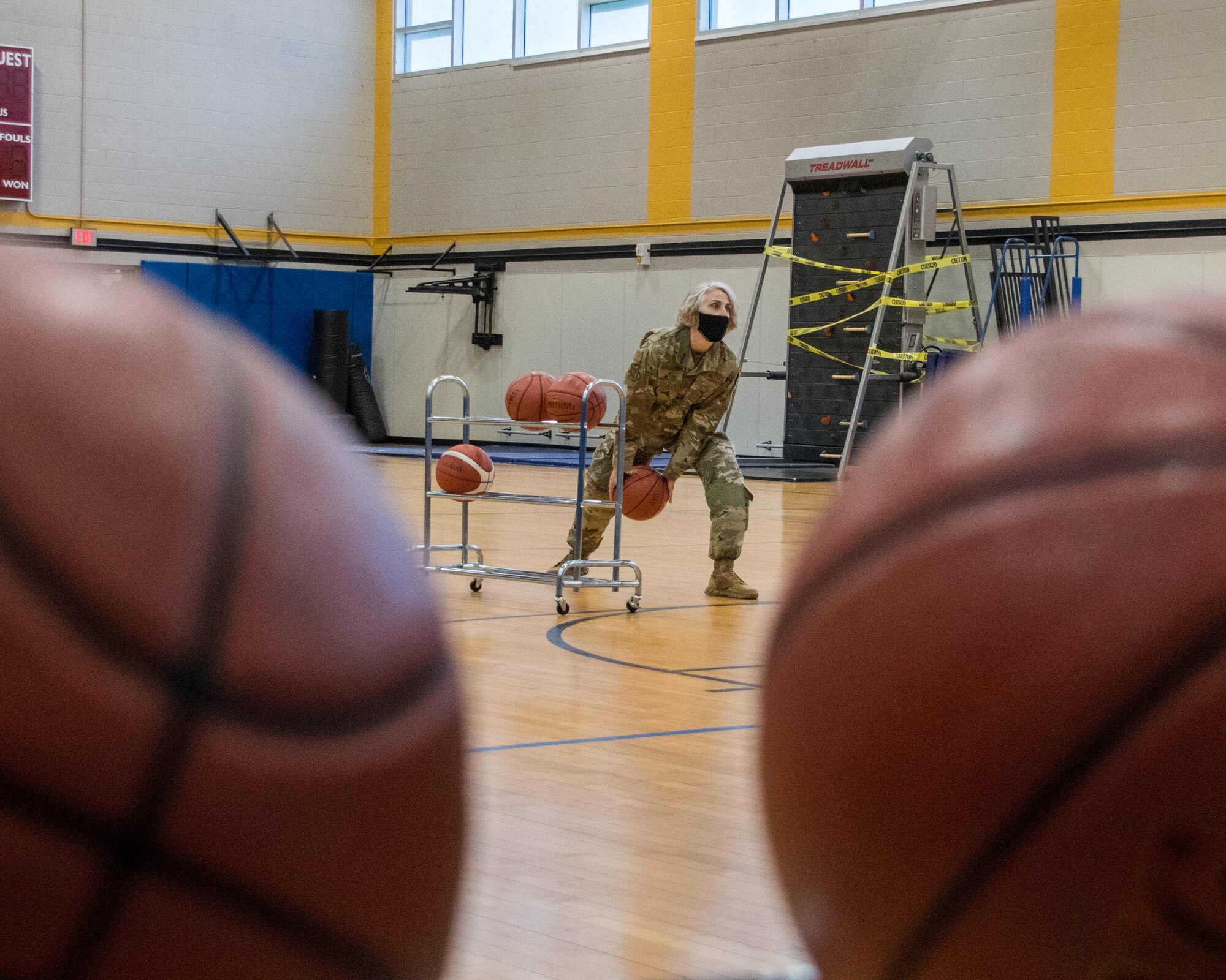 Chief Master Sgt. Vicki Robertson, 94th Airlift Wing command chief, participates in the three-point contest held at the fitness center, May 1 at Dobbins Air Reserve Base, Ga. The 94th Force Support Squadron held a three-point and free throw contest to commemorate the reopening of the fitness center that spanned from April 30 to May 1. (U.S. Air Force photo/Senior Airman Kendra Ransum)