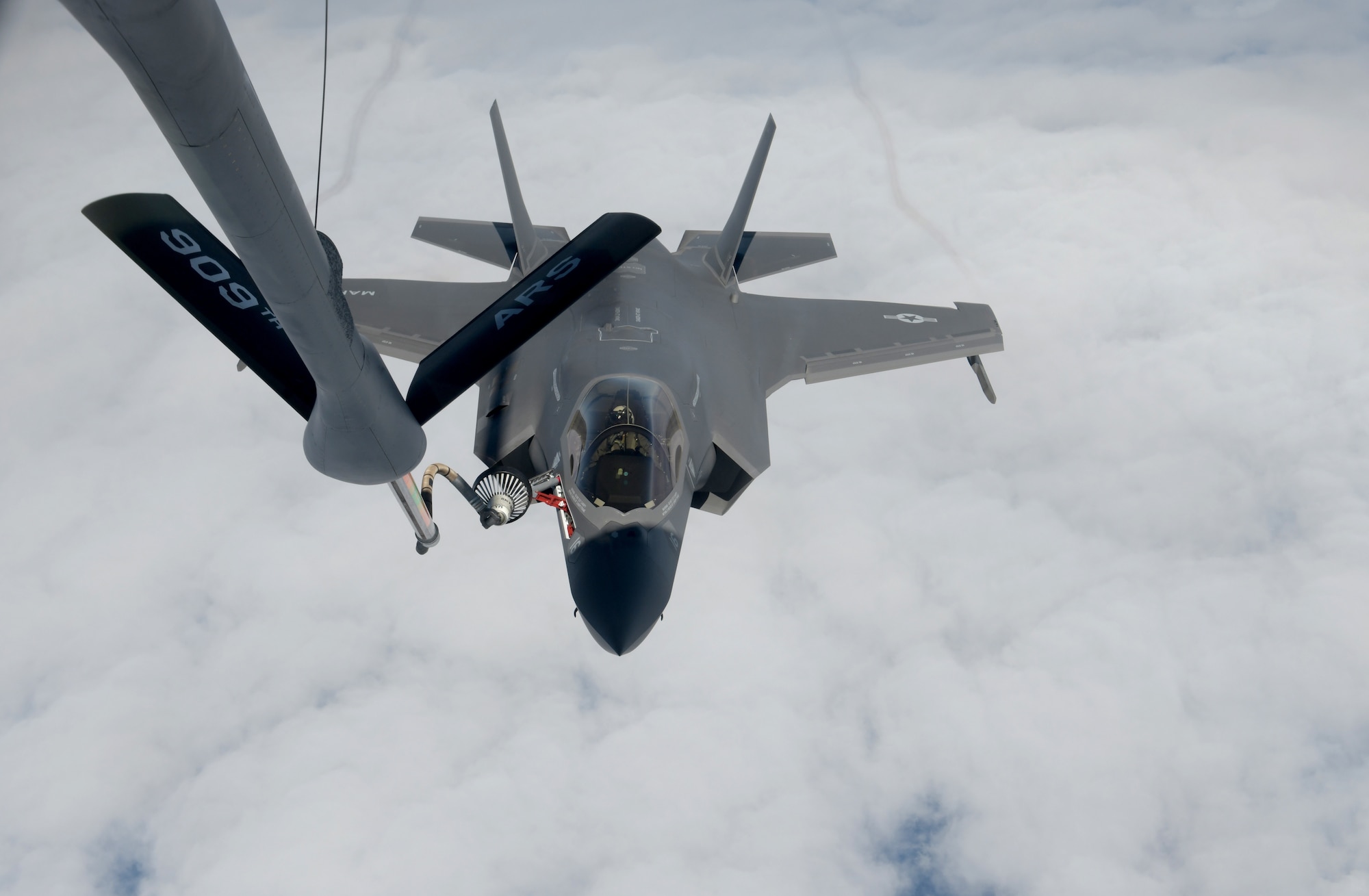 KC-135 from Kadena Air Base, Japan, refuels Marine aircraft during training exercise.