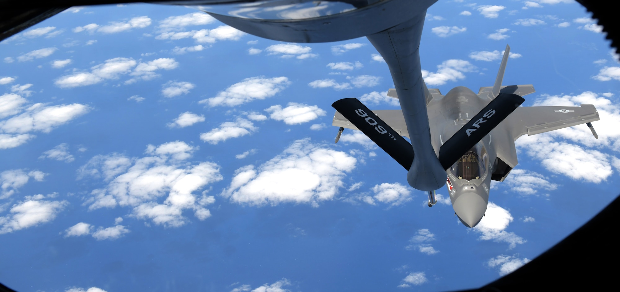 KC-135 from Kadena Air Base, Japan, refuels Marine aircraft during training exercise.