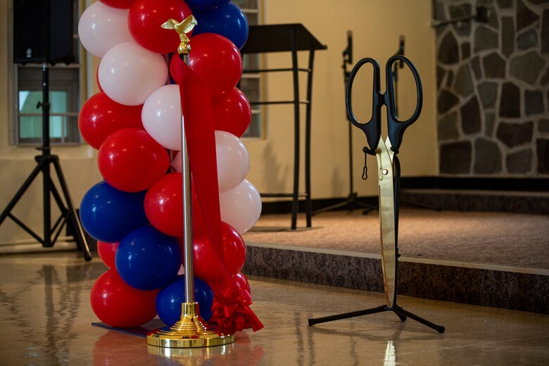 Scissors used to cut the grand opening ribbon are displayed at the grand opening of the Marine Corps Community Services (MCCS) Community Center on Camp McTureous, Okinawa, Japan, April 23, 2021. MCCS hosted the grand opening of the Camp McTureous Community Center which included a ribbon cutting ceremony to celebrate its addition to the installation. The center is available for Status of Forces Agreement members and their families to rent for a wide range of activities and events. (U.S. Marine Corps photo by Lance Cpl. Alex Fairchild)