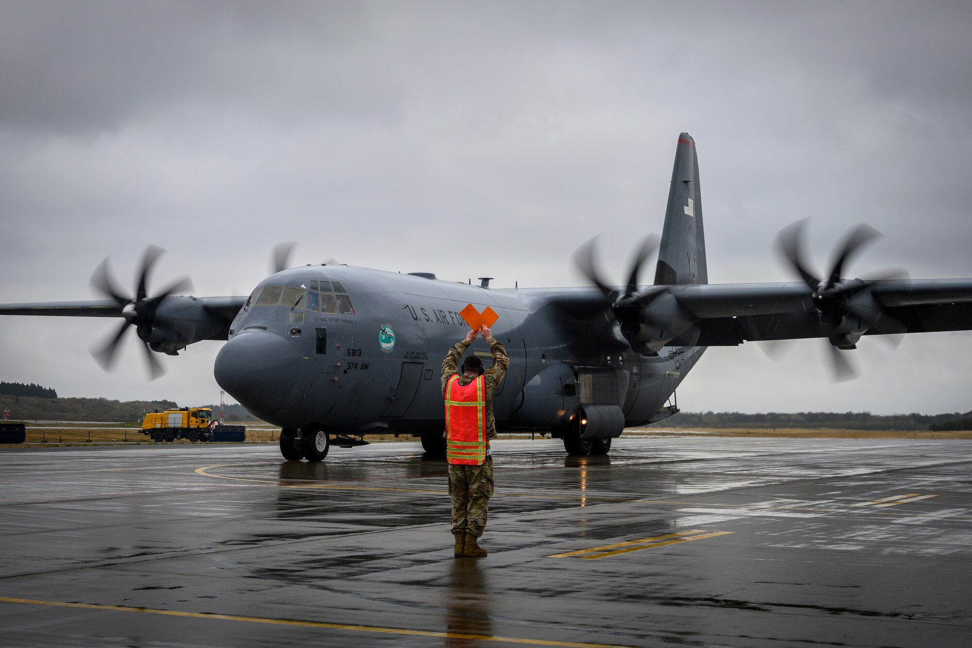 A U.S. Air Force Airman marshals a C-130J Super Hercules from the 374th Airlift Wing during the Beverly Sunrise 21-05 Readiness Exercise at Misawa Air Base, Japan, May 2, 2021. The C-130s are transporting cargo and personnel to support the 35th Fighter Wing’s Agile Combat Employment capabilities. (U.S. Air Force photo by Airman 1st Class China M. Shock)