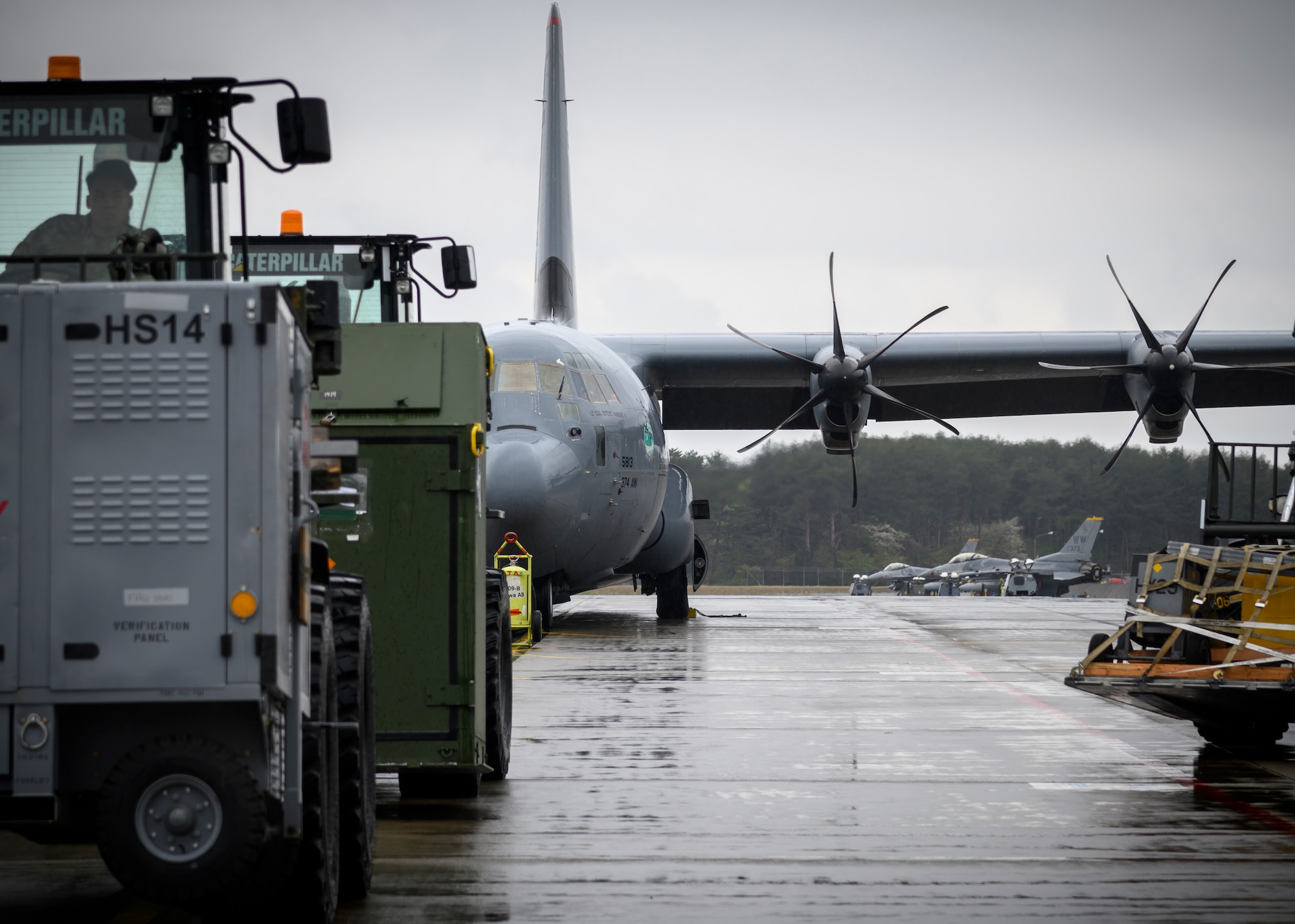 35th Logistics Readiness Squadron personnel prepare to load cargo during the Beverly Sunrise 21-05 Readiness Exercise at Misawa Air Base, Japan, May 2, 2021. The C-130s are transporting cargo and personnel to support the 35th Fighter Wing’s Agile Combat Employment capabilities. (U.S. Air Force photo by Airman 1st Class China M. Shock)