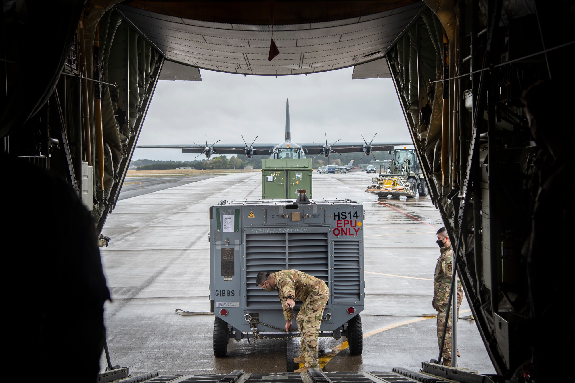 A U.S. Air Force Airman loads cargo onto a C-130J Super Hercules from the 374th Airlift Wing during the Beverly Sunrise 21-05 Readiness Exercise at Misawa Air Base, Japan, May 2, 2021. The C-130s are transporting cargo and personnel to support the 35th Fighter Wing’s Agile Combat Employment capabilities. (U.S. Air Force photo by Airman 1st Class China M. Shock)