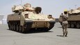 Capt. Shayna Taylor, officer in charge of the port support element, 1st Battalion, 35th Armored Regiment, 2nd Brigade Combat Team, 1st Armored Division, ground guides the driver of an M2/A2 Bradley Fighting Vehicle to the proper staging area as part of the logistics exercise, LOGEX 21, at  the industrial port at Yanbu, Kingdom of Saudi Arabia April 20, 2021. LOGEX 21 demonstrates the 1st Theater Sustainment Command’s readiness and ability to provide responsive support to U.S. and partner nation forces from anywhere in the U.S. Central Command theater, exercising the Trans-Arabian Network.  (U.S. Army photo by Capt. Elizabeth Rogers)
