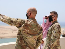 Col. Michael Ludwick, commander of the 595th Transportation Brigade (SDDC) and Lt. Col. Andrew Kocsis, commander of the 840th Transportation Battalion (SDDC), receive a tour of the commercial port at Yanbu, Kingdom of Saudi Arabia, from Mr. Rami Ahmed Alshmrani, Prince Abdulmohsin Bin Abdulaziz Airport Operations Director, ahead of the arrival of the Liberty Peace cargo vessel as part of logistics exercise, LOGEX 21, April 19, 2021. LOGEX 21 demonstrates the 1st Theater Sustainment Command’s readiness and ability to provide responsive support to U.S. and partner nation forces from anywhere in the U.S. Central Command theater, exercising the Trans-Arabian Network.   (U.S. Army photo by Capt. Elizabeth Rogers)