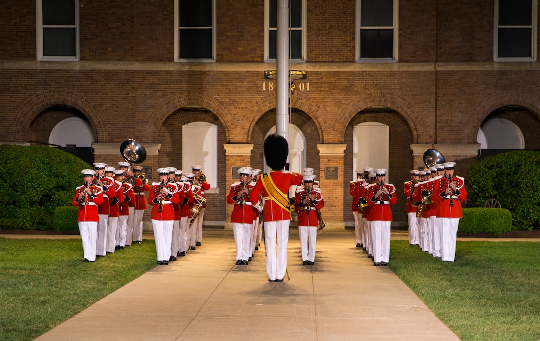 Marines with “The President’s Own,” U.S. Marine Band march onto the parade deck during the Friday Evening Parade at Marine Barracks Washington, D.C., April 30, 2021. The Commanding Officer of Marine Barracks Washington Col. Teague A. Pastel was the hosting official, and the 38th Commandant of the Marine Corps Gen. David H. Berger was the guest of honor. (U.S. Marine Corps photo by Lance Cpl. Tanner Lambert)