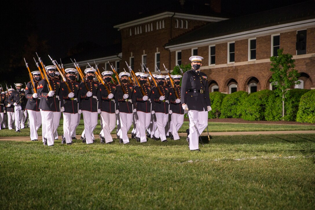 Captain Nick Maguire, platoon commander, Alpha Company, executes “eyes right” during the Friday Evening Parade at Marine Barracks Washington, D.C., April 30, 2021. The Commanding Officer of Marine Barracks Washington Col. Teague A. Pastel was the hosting official, and the 38th Commandant of the Marine Corps Gen. David H. Berger was the guest of honor. (U.S. Marine Corps photo by Lance Cpl. Tanner Lambert)