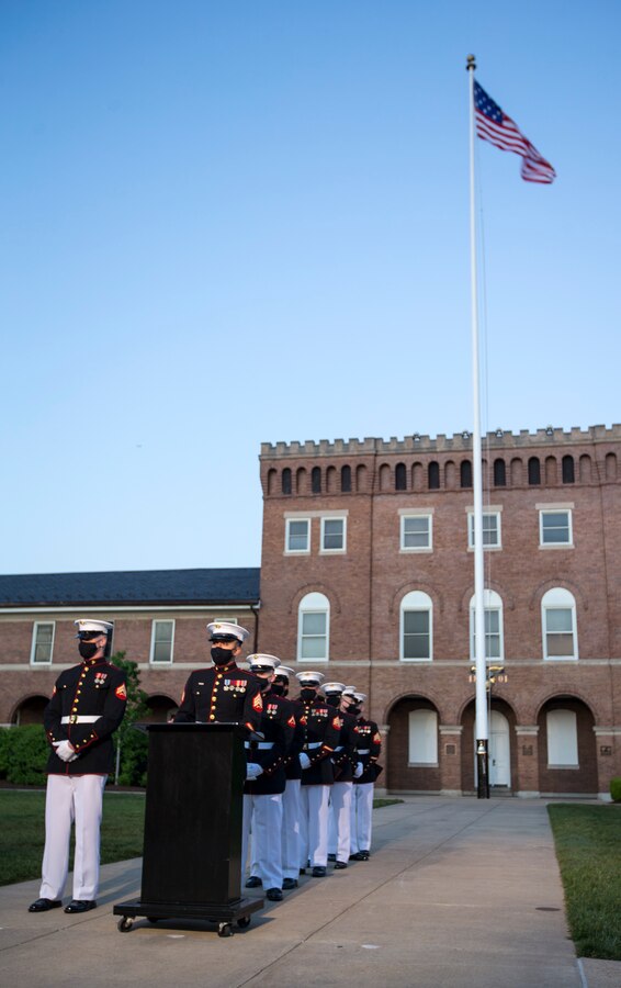 Marines with Headquarters and Service Company wait to seat guests during the Friday Evening Parade at Marine Barracks Washington, D.C., April 30, 2021. The Commanding Officer of Marine Barracks Washington Col. Teague A. Pastel was the hosting official, and the 38th Commandant of the Marine Corps Gen. David H. Berger was the guest of honor. (U.S. Marine Corps photo by Lance Cpl. Allen Sanders)