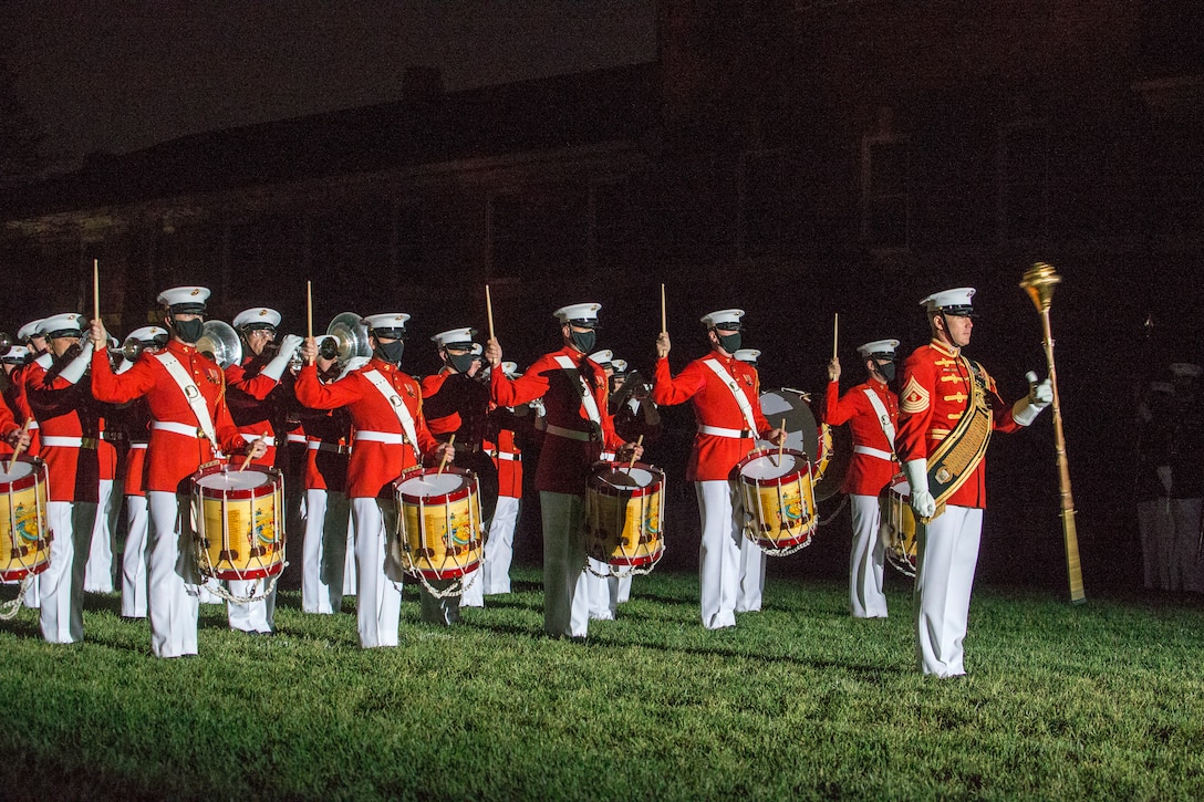 Marines with “The Commandant’s Own,” U.S. Marine Drum and Bugle Corps perform the “slow march” sequence during the Friday Evening Parade at Marine Barracks Washington, D.C., April 30, 2021. The Commanding Officer of Marine Barracks Washington Col. Teague A. Pastel was the hosting official, and the 38th Commandant of the Marine Corps Gen. David H. Berger was the guest of honor. (U.S. Marine Corps photo by Lance Cpl. Allen Sanders)